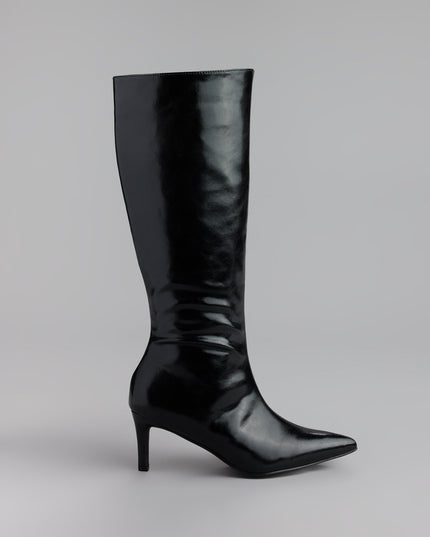 Style made simple with the Sleek Stance Faux Leather Stiletto Boots, trendy women’s shoes that take your outfit from basic to bold in one step.